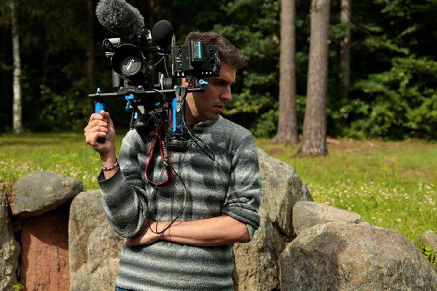 Producer Director Guy Natanel holding cameraFilm and Video Production