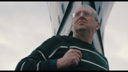 Richard in front of a submarine