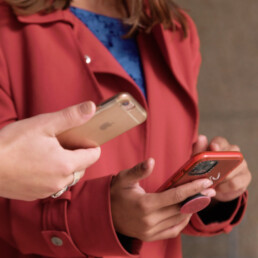 close up female fingers using phones