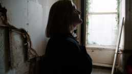 woman in abandoned building