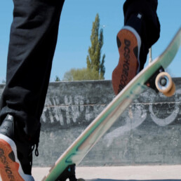 a close up of a skateboard doing a trick