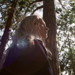 a low angle shot of a woman in a forest