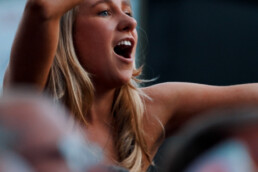 A woman sings along at the Lympstone Manor Celebration of Speed 2023