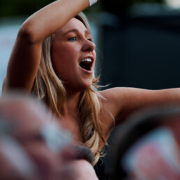 A woman sings along at the Lympstone Manor Celebration of Speed 2023