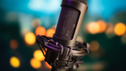 Professional studio microphone on blurred bokeh lights background